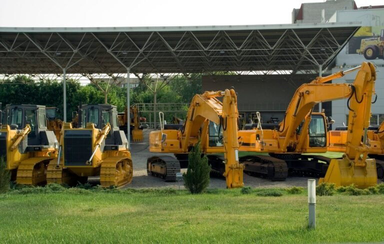 Plant and machinery parked in an outdoor equipment yard